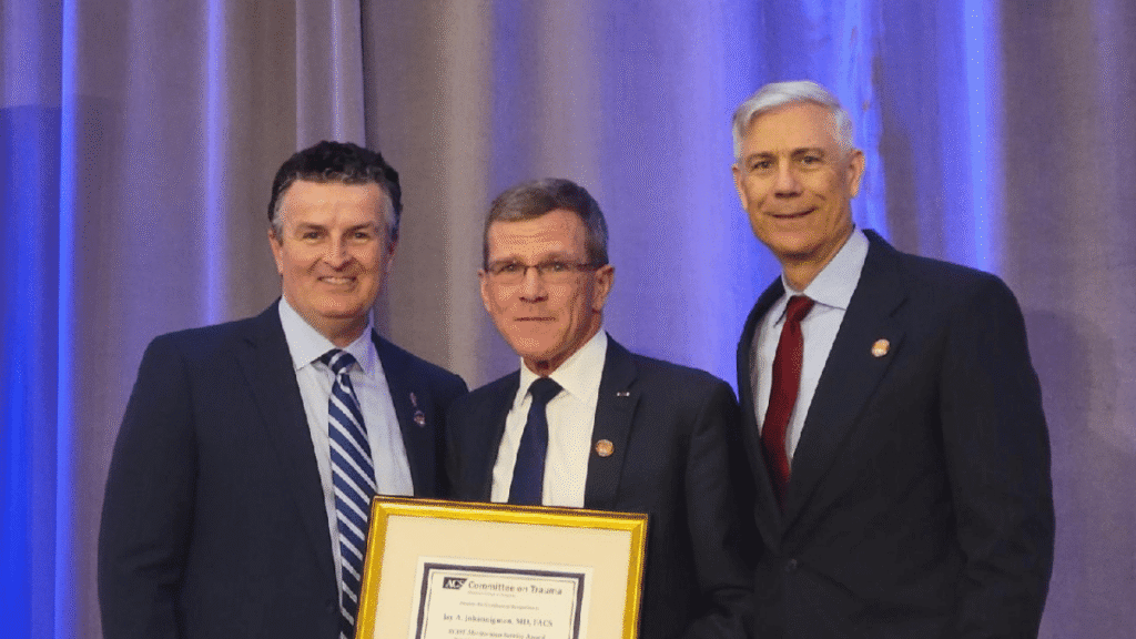 Receiving the Meritorious Service Award for trauma care excellence.